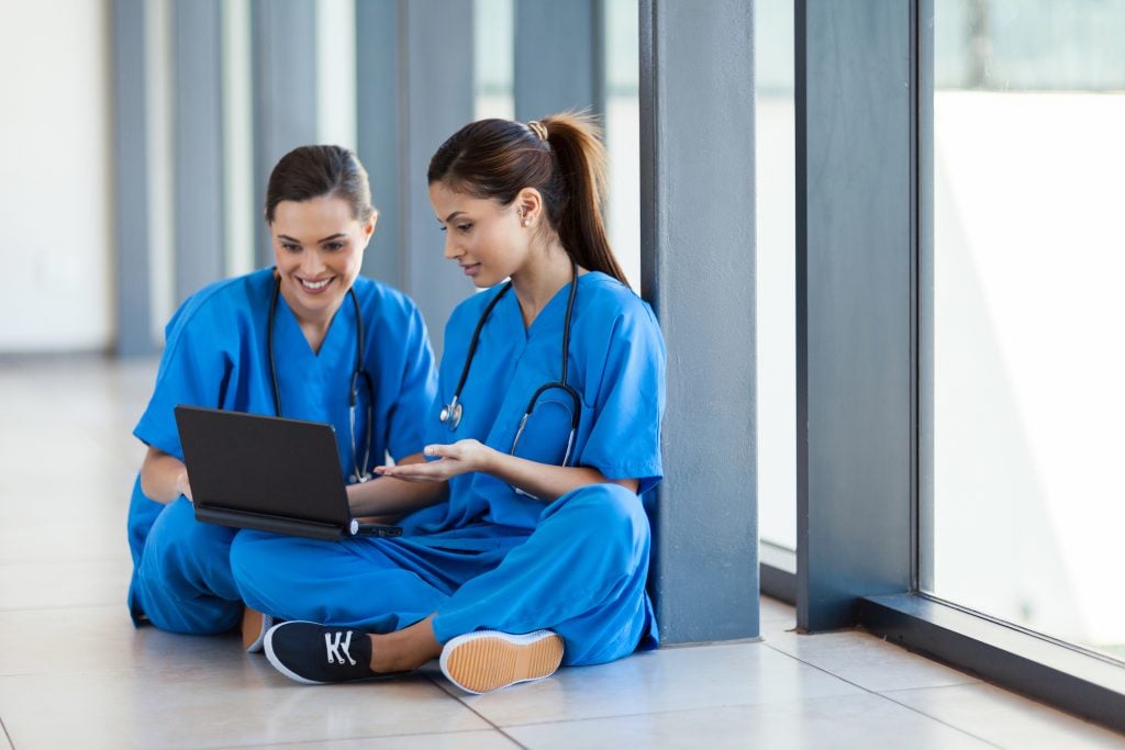 image of two nurses using laptop